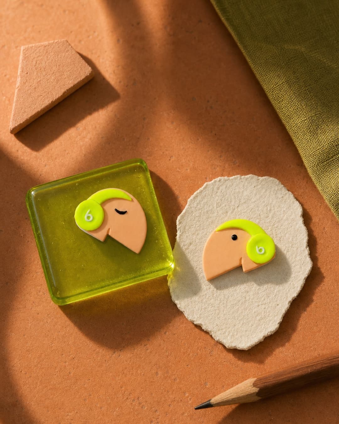 Lime Curl Profile Studs in a terracotta studio still life