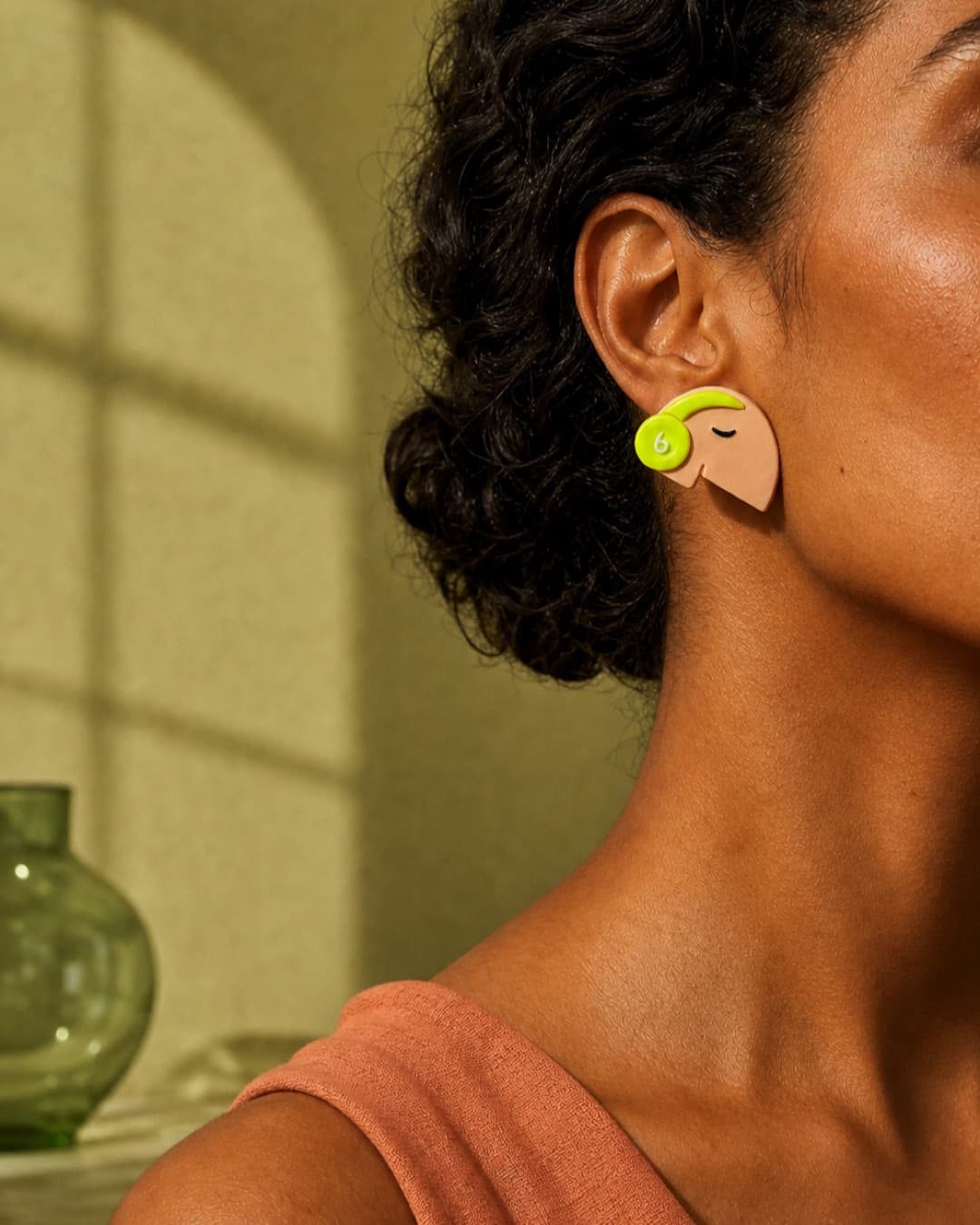 Lime Curl Profile Studs worn at natural scale