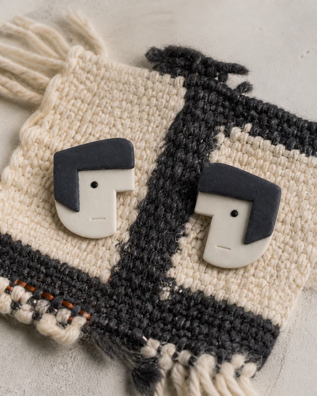 Navy Bob Studs in a woven studio still life