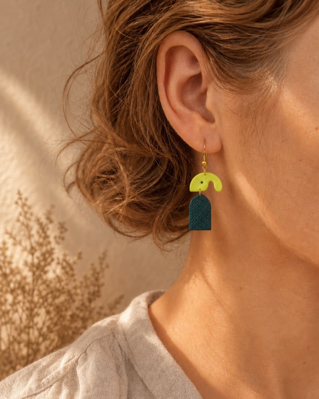 Neon Arch Teal Dangles worn at natural scale
