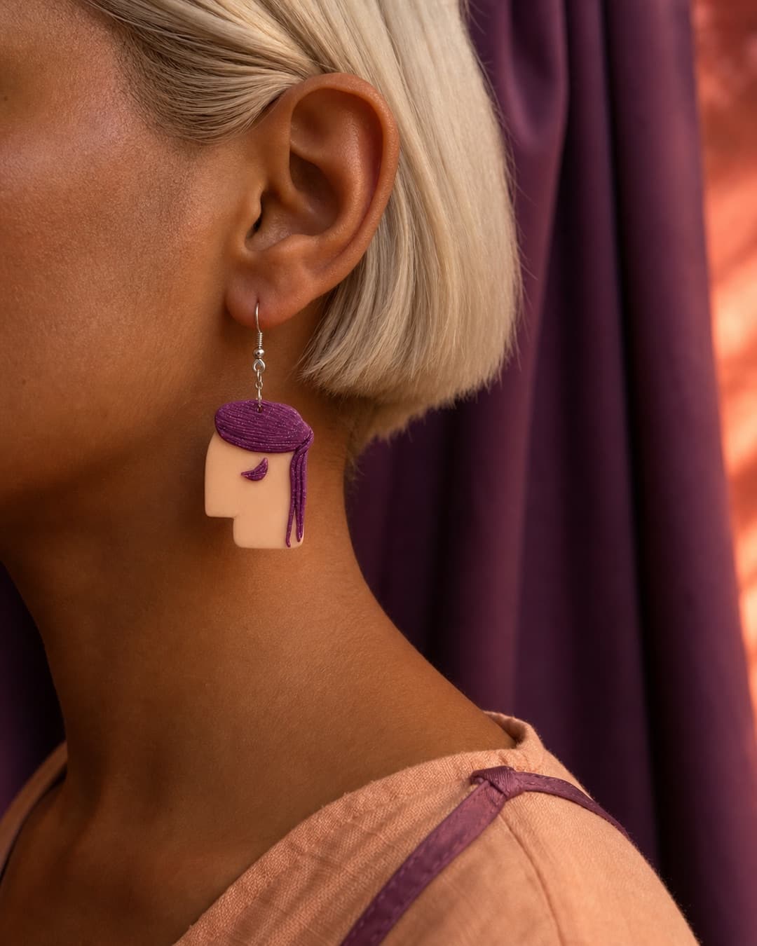 Purple Bob Profile Dangles worn at natural scale